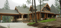 Custom Log Home With Portico Driveway